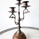 Pair of antique wooden and brass candlesticks