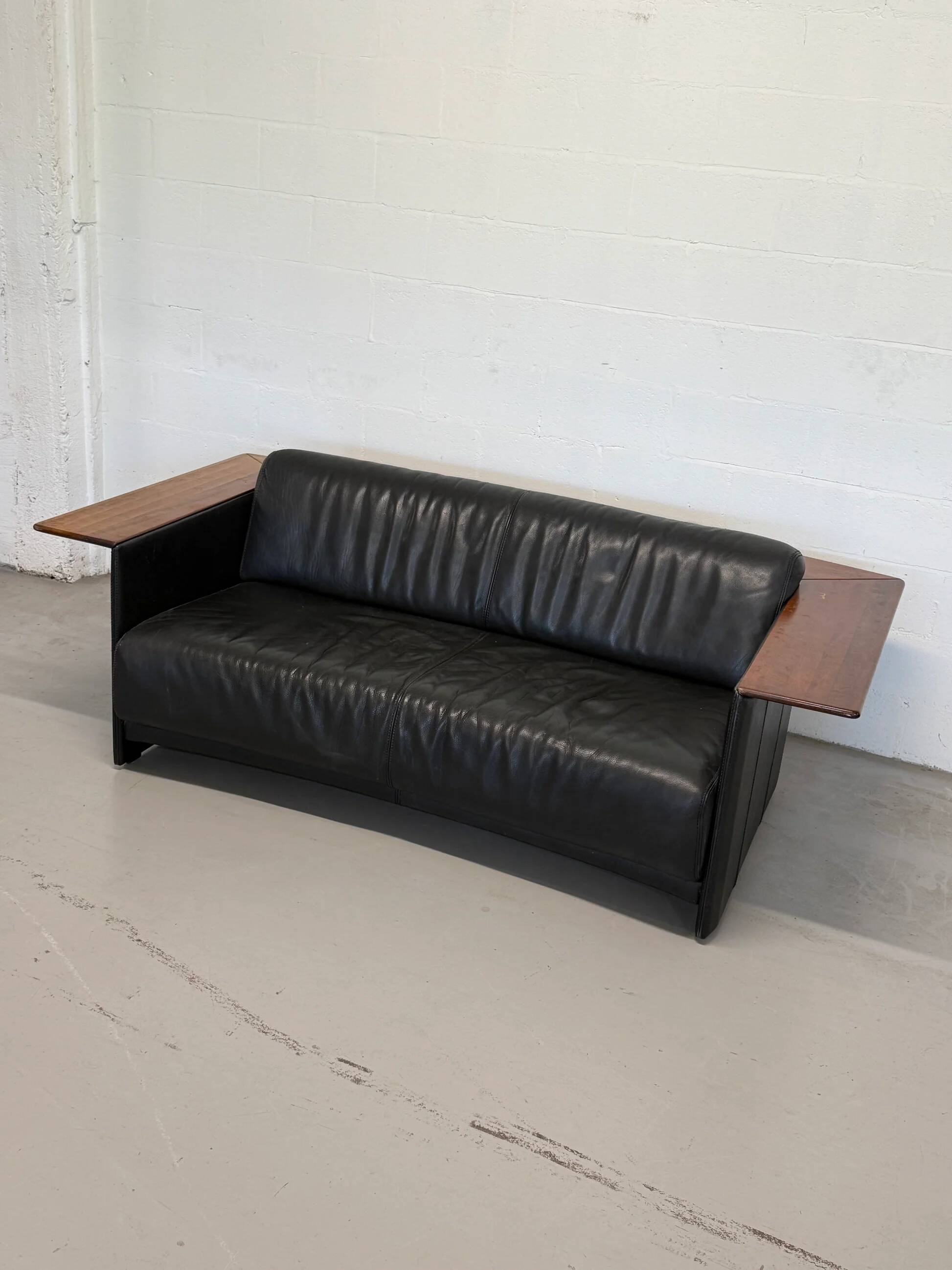 Vintage Black Leather Loveseat with Cantilevered Walnut Tray Arms