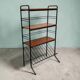 Vintage black shelf/coat rack with wooden accents.