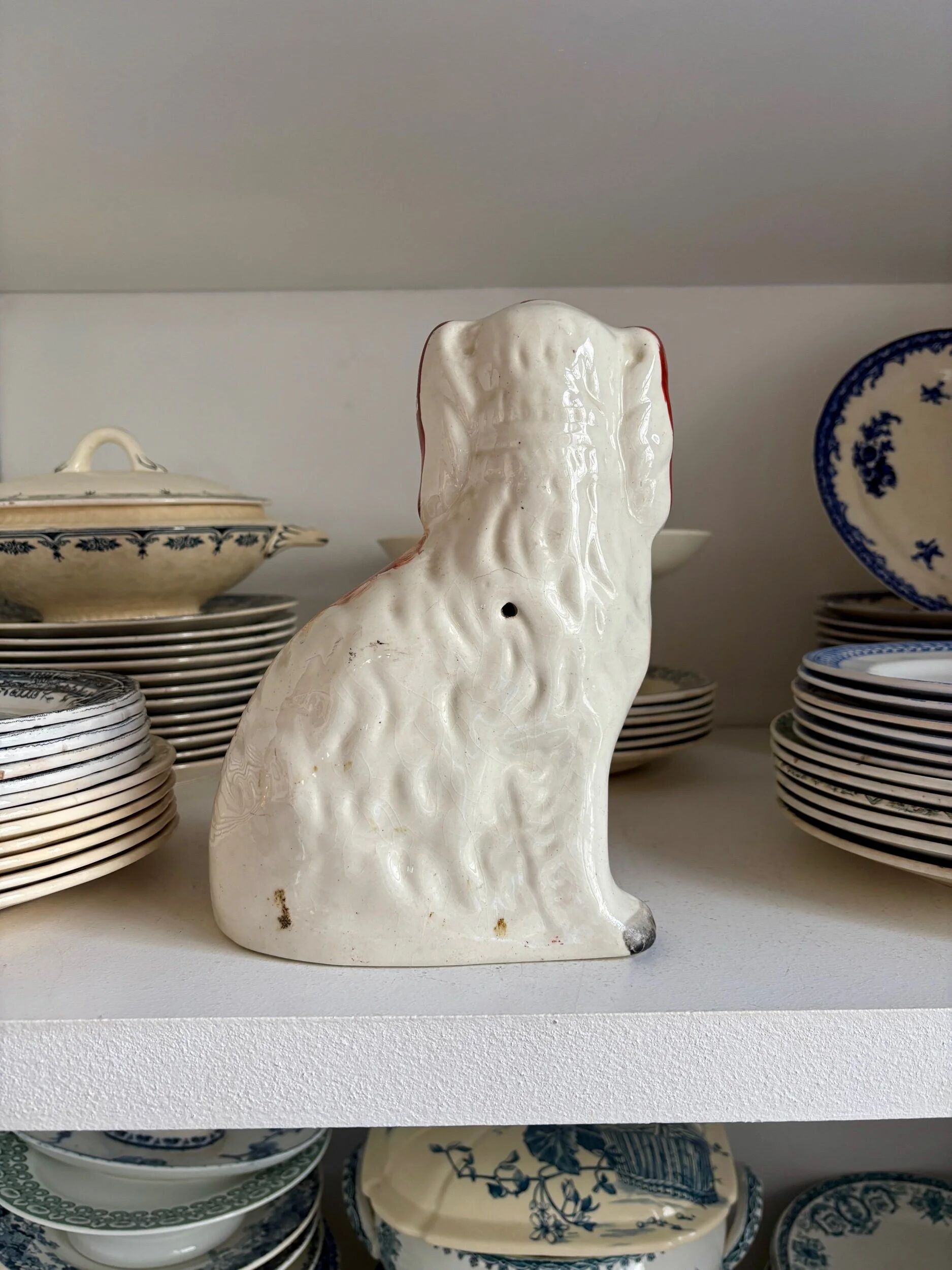 Staffordshire porcelain King Charles Cavalier dog in red, number 1, 19th century.