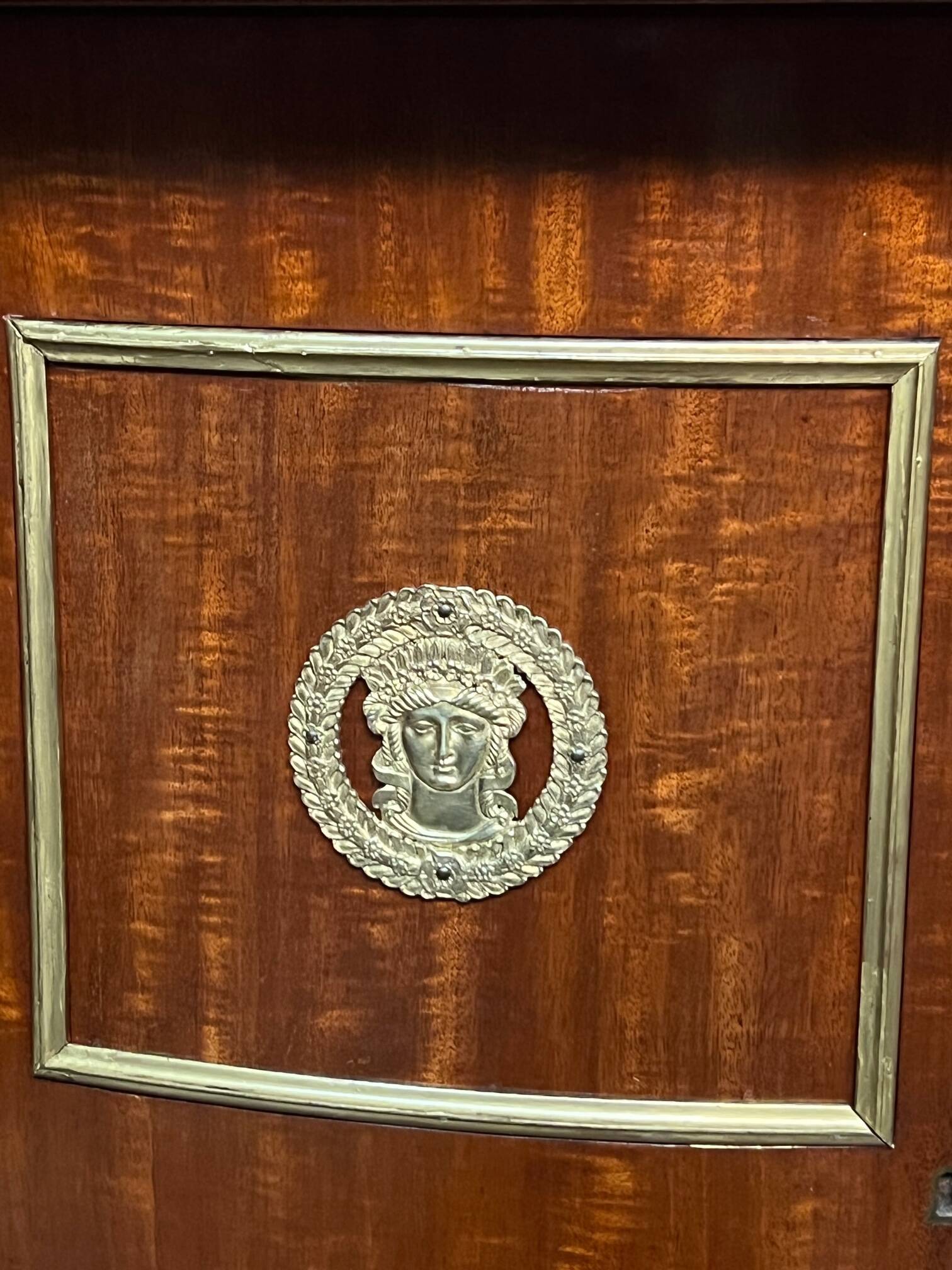 Empire style sideboard. Mahogany. Gilded bronze decoration.