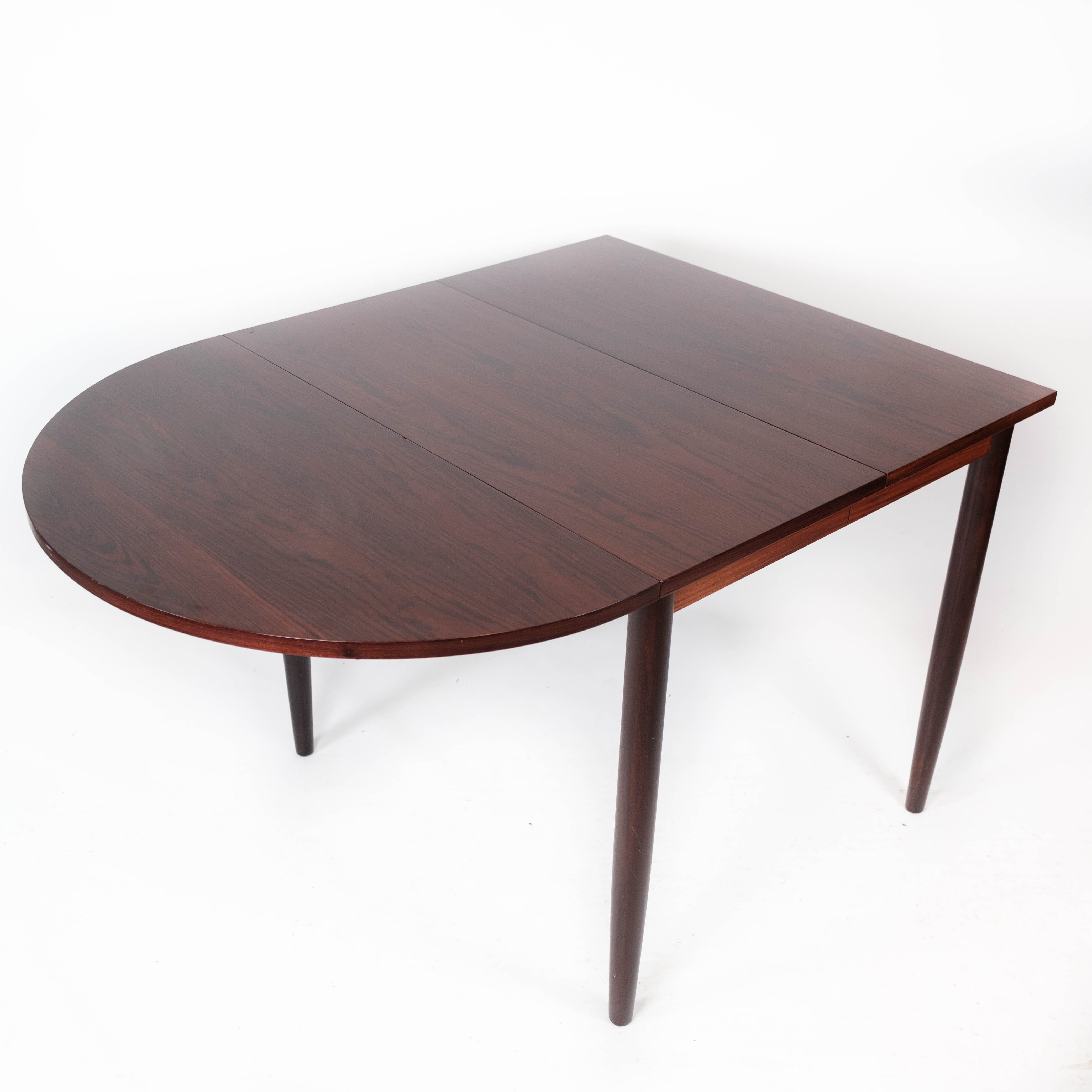 Dining table in rosewood with extension plates, designed by Arne Vodder, 1960s