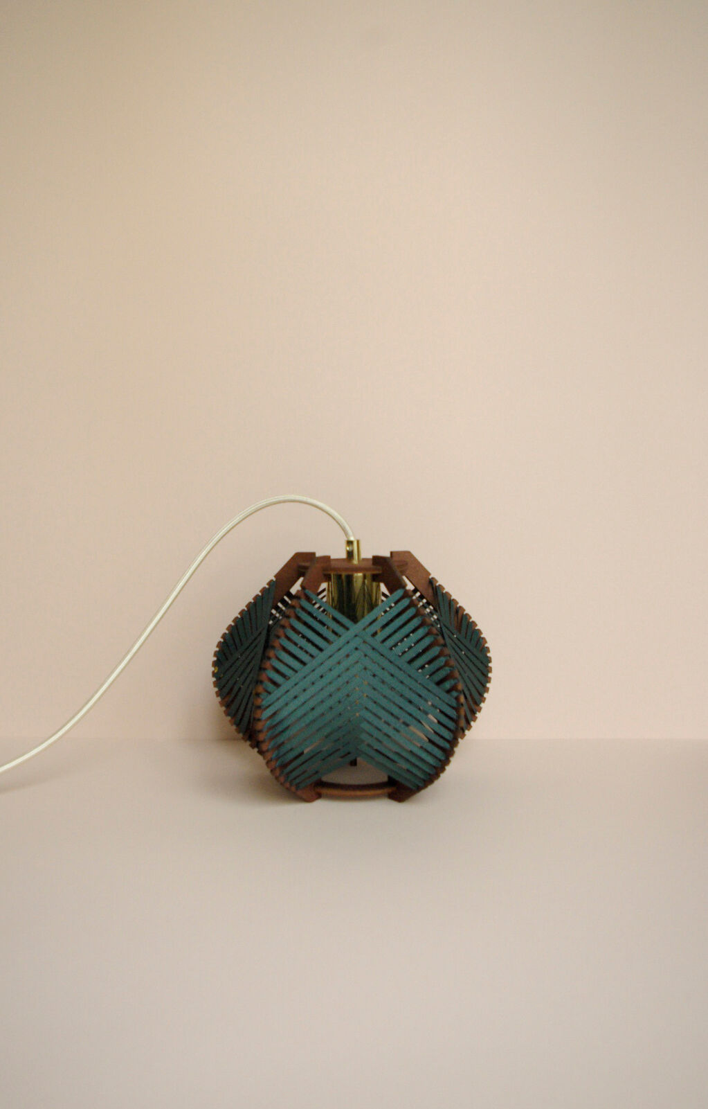 Dark green woven lamp to hang