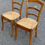 2 solid wood and straw dining chairs