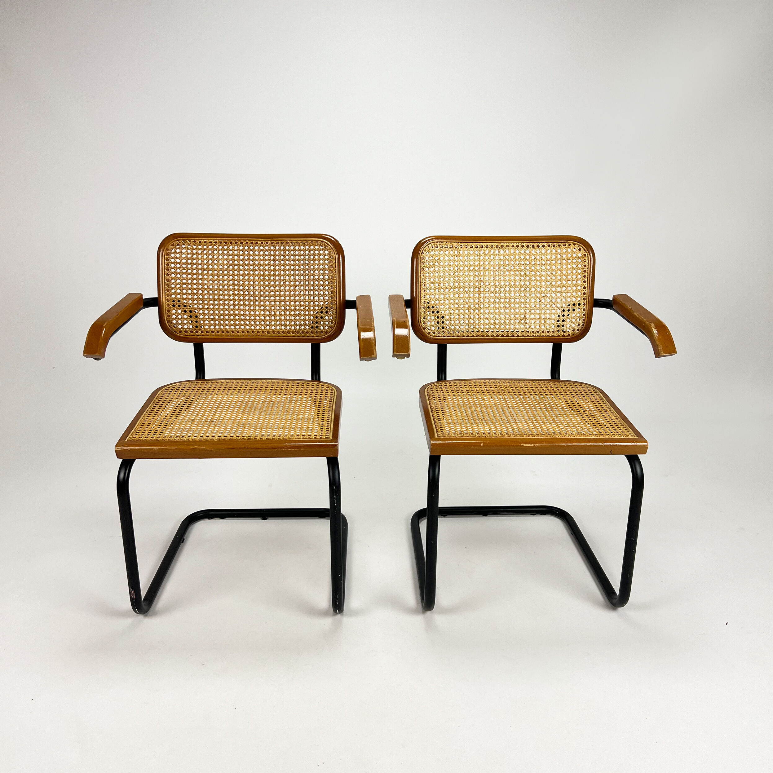 Set of 2 tubular black frame and cane cantilever dining chairs Breuer, italy, 1970s