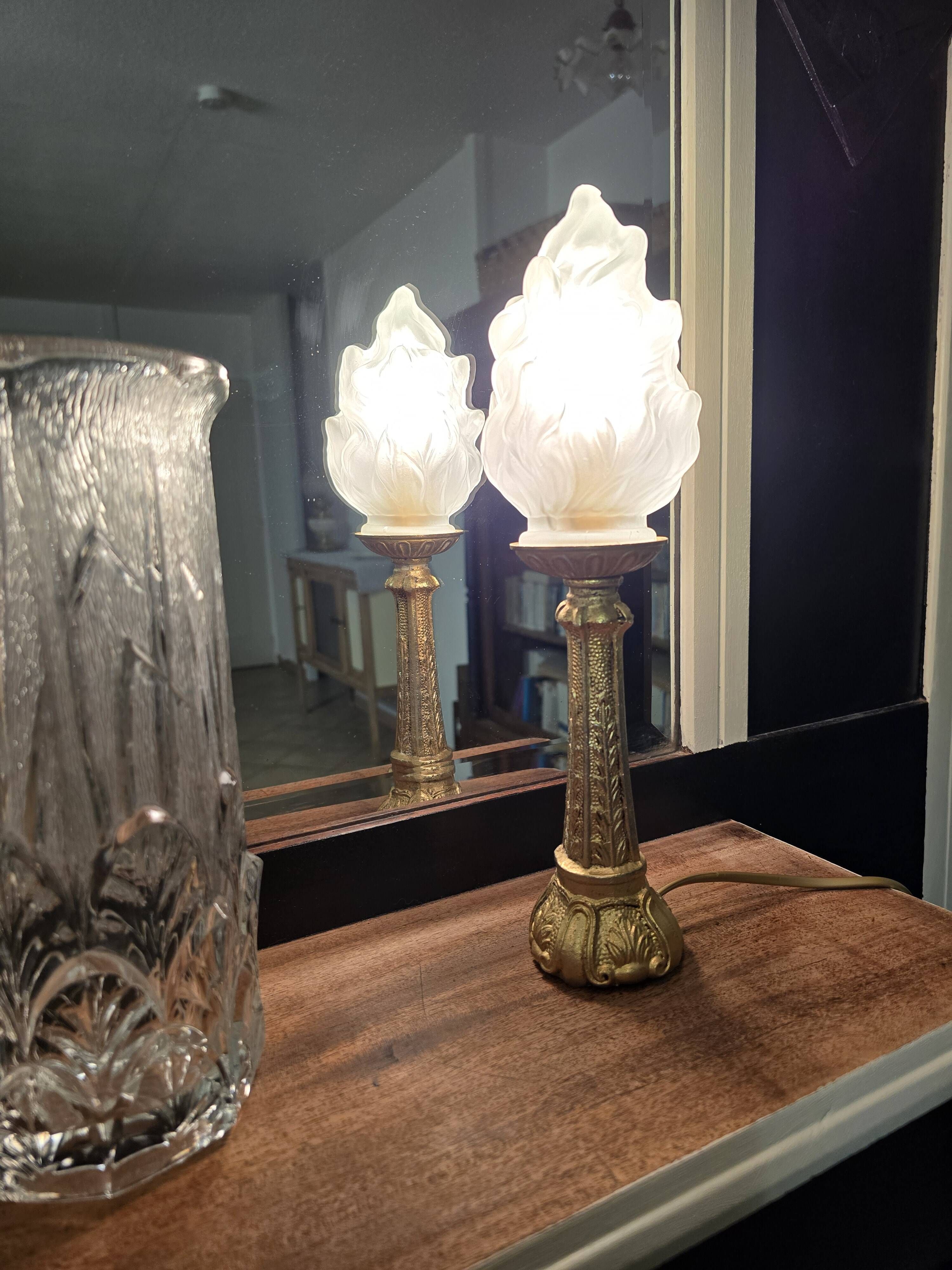Table lamp with brass base and vintage flame globe