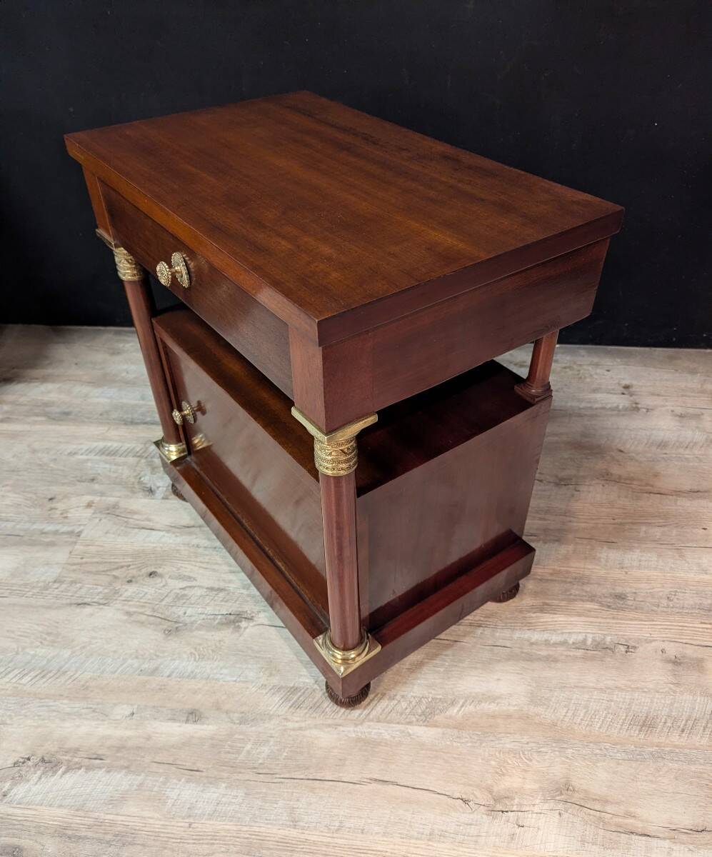 Pair of Empire style bedside tables in mahogany and gilded bronze