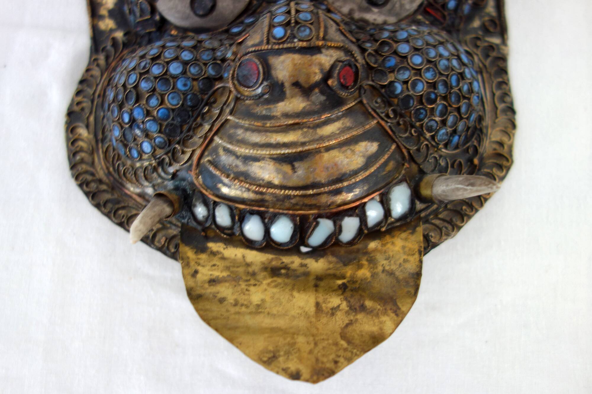 Vintage ritual mask in repoussé brass from Nepal/Tibet.