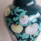 Vintage ceramic lamp with floral decoration.