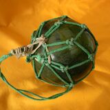 Green glass fishing net float.