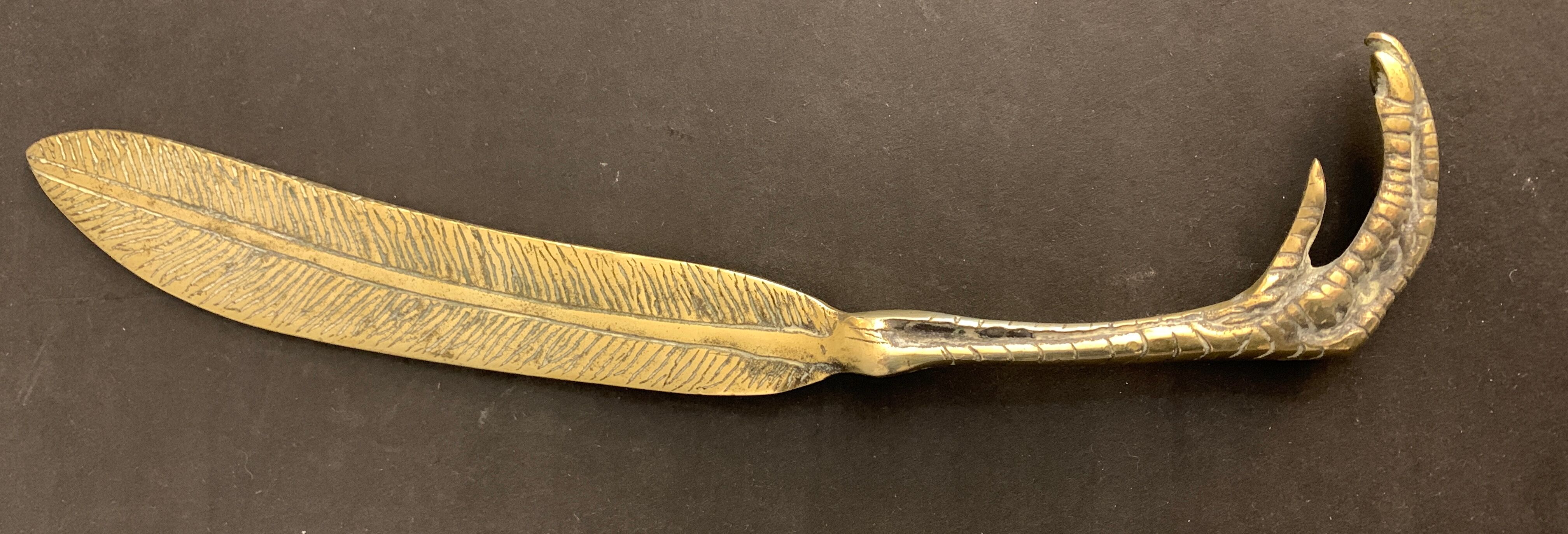 Paper cup or old bronze letter opener, eagle claw shape