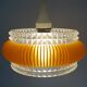 Transparent plastic space age lustre with orange band from the 70s.