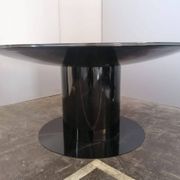 Black lacquered glass table and glass in the hoof style, Italy.