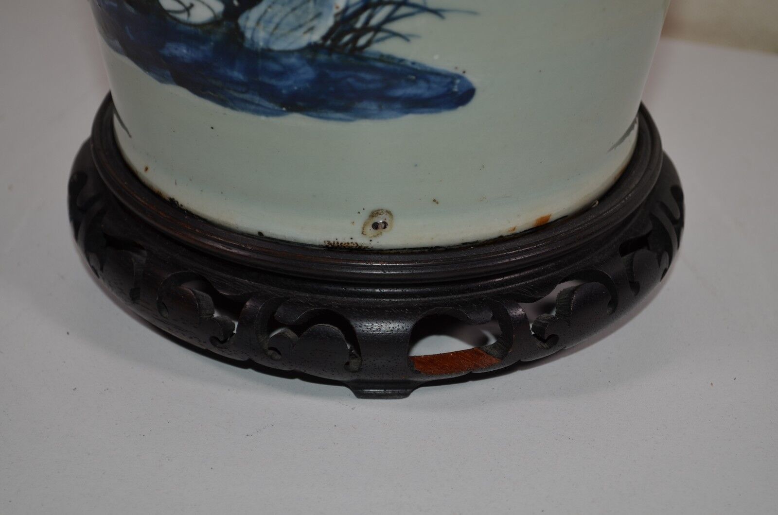 China. Porcelain mallet vase with blue and white phoenix decoration on a rock.