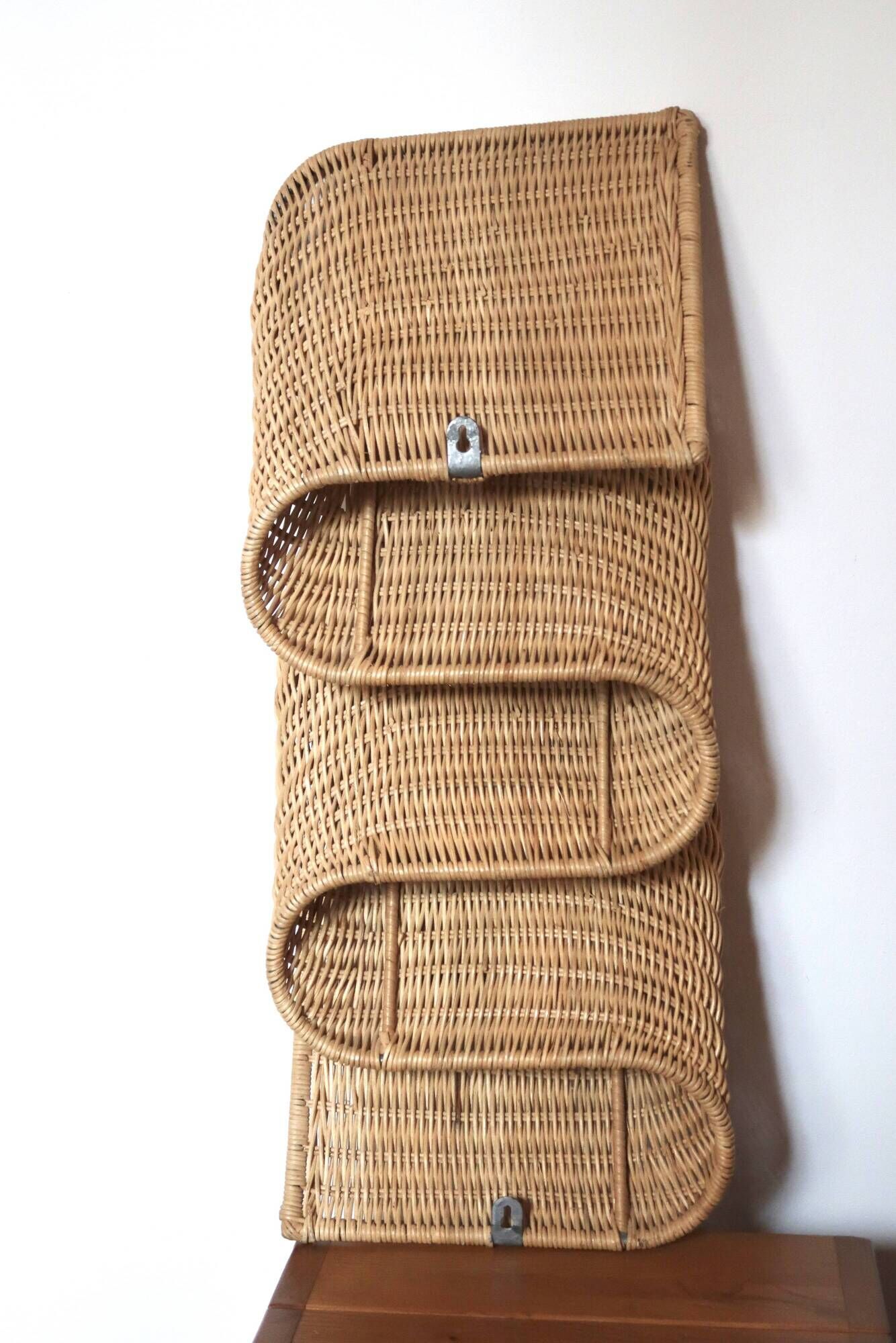 Wall-mounted magazine rack TIBY in rattan wicker by Karl Malmvall for Ikea from the 90s.