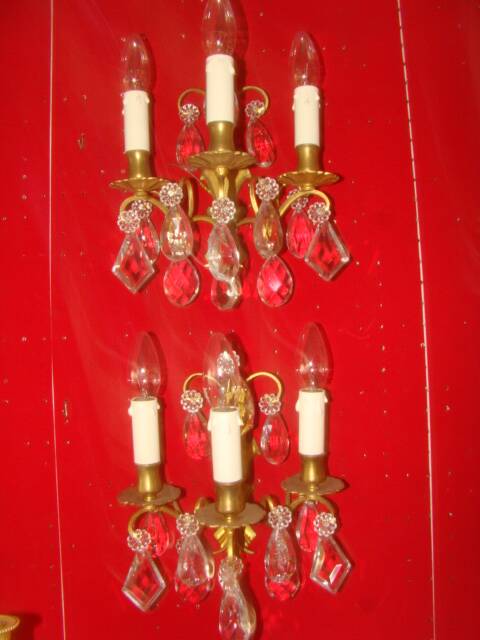 Pair of bronze and crystal wall lights with three candle holders from the early 20th century.