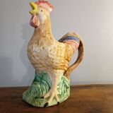 Vintage slipware jug in the shape of a rooster.