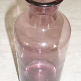 Plum-colored glass bottle with bubble