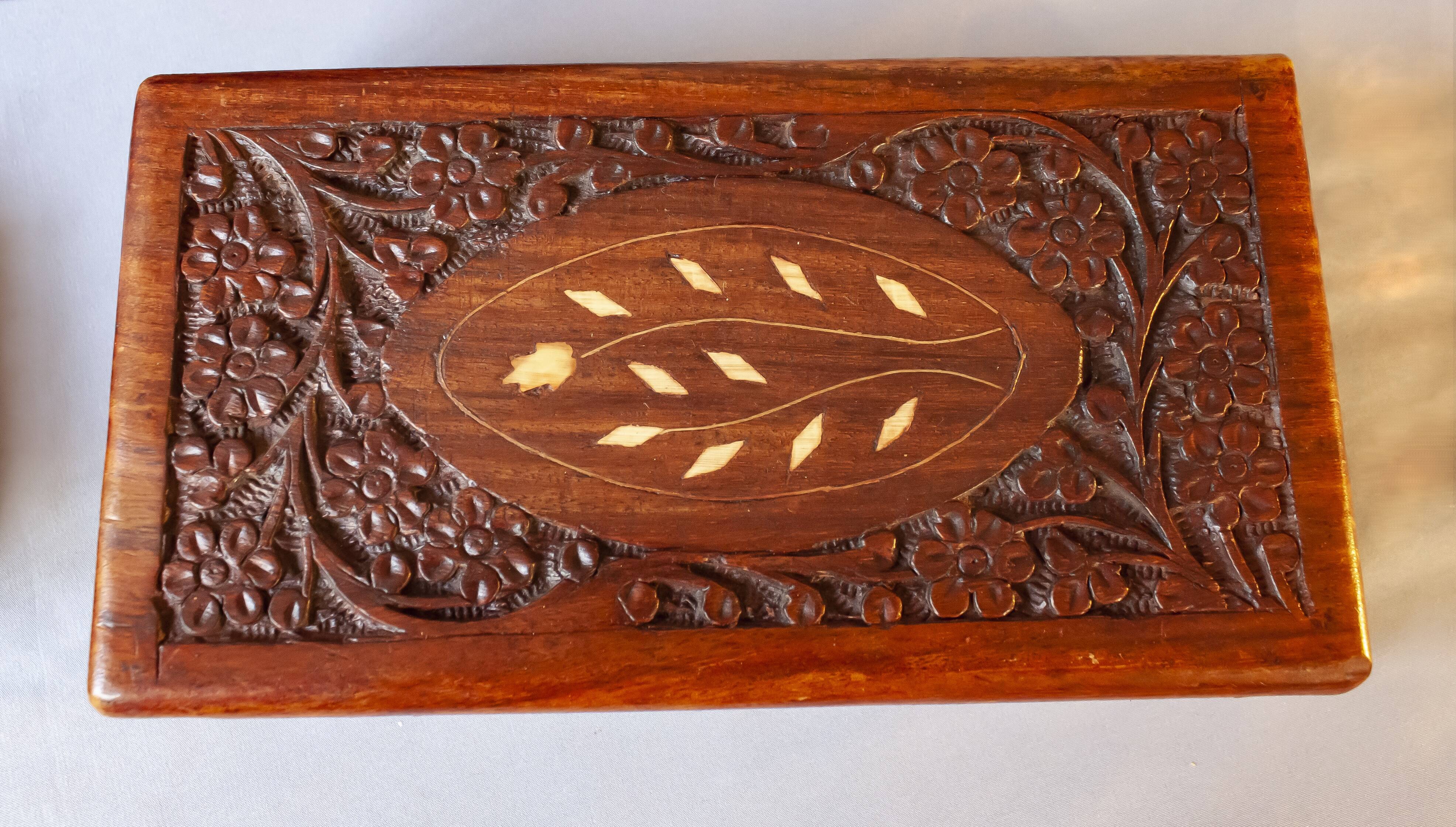 Antique hand-carved wooden boxes.