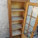 Showcase an old door, small bookshelf.