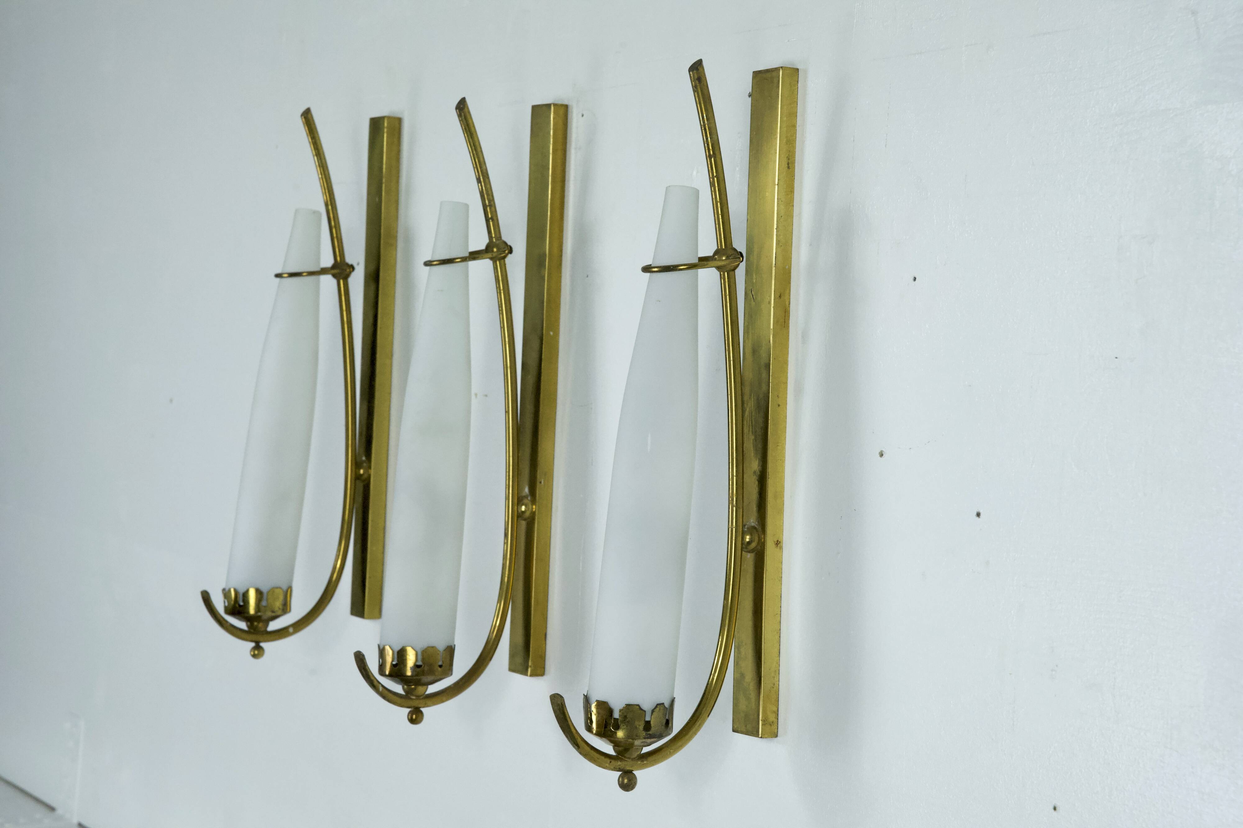 Set of three sconces in brass and triplex opaline glass. Italy 1950s