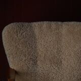 Pair of Mid Century Modern Swedish lounge chairs in birch and lamb's wool, 1960s.