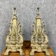 pair of Empire period dolphin firedogs in gilded bronze
