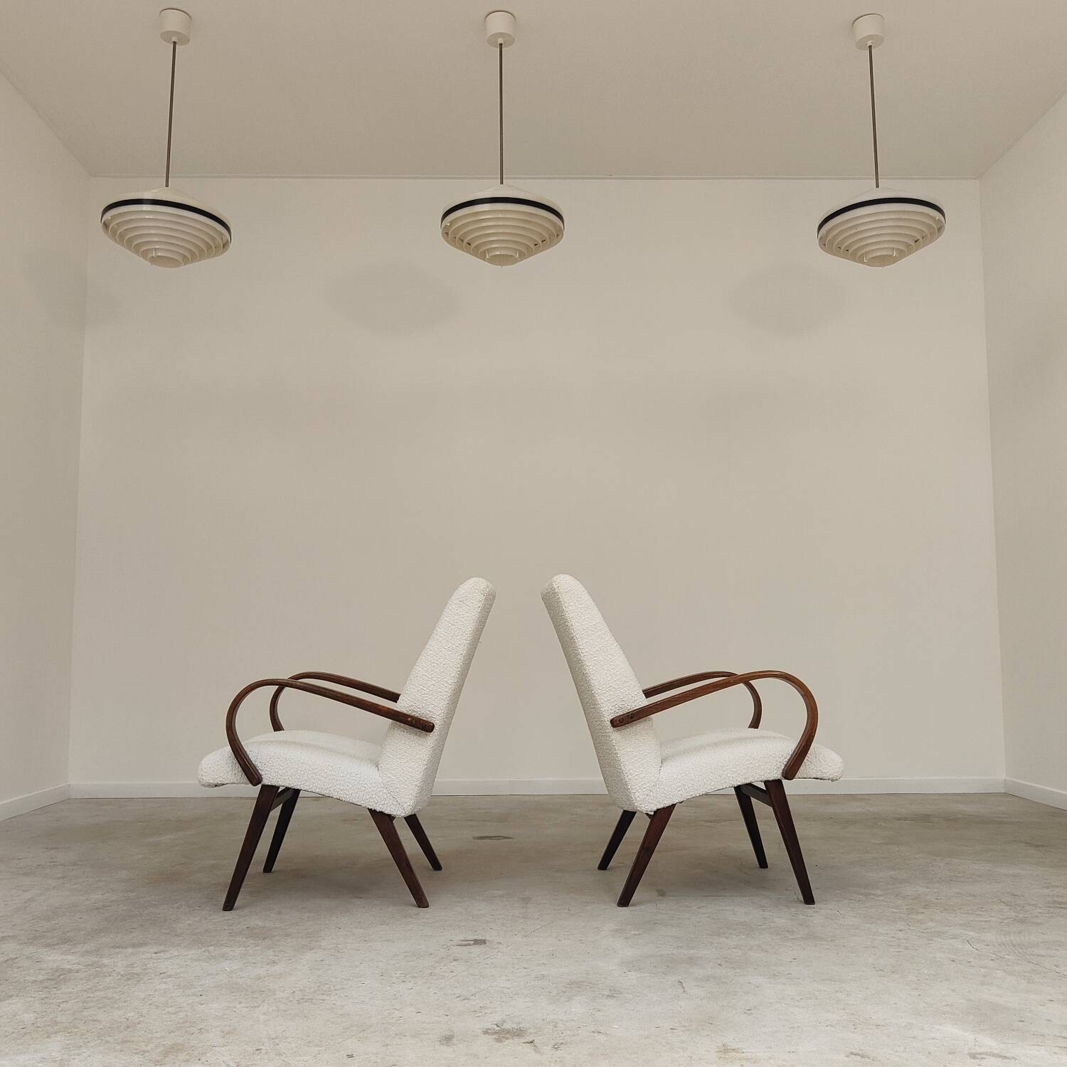 Pair of Jaroslav Smidek armchairs for Ton Bystrice, restored with white boucle, 1960.