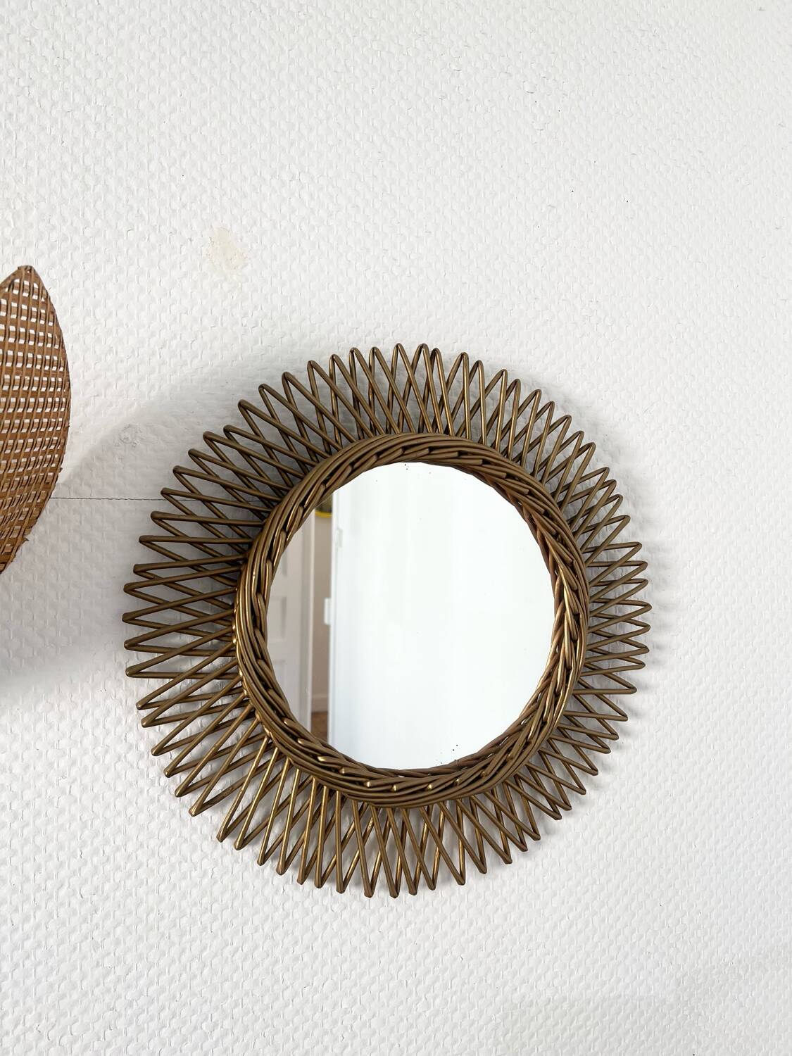 Vintage gold rattan sun mirror