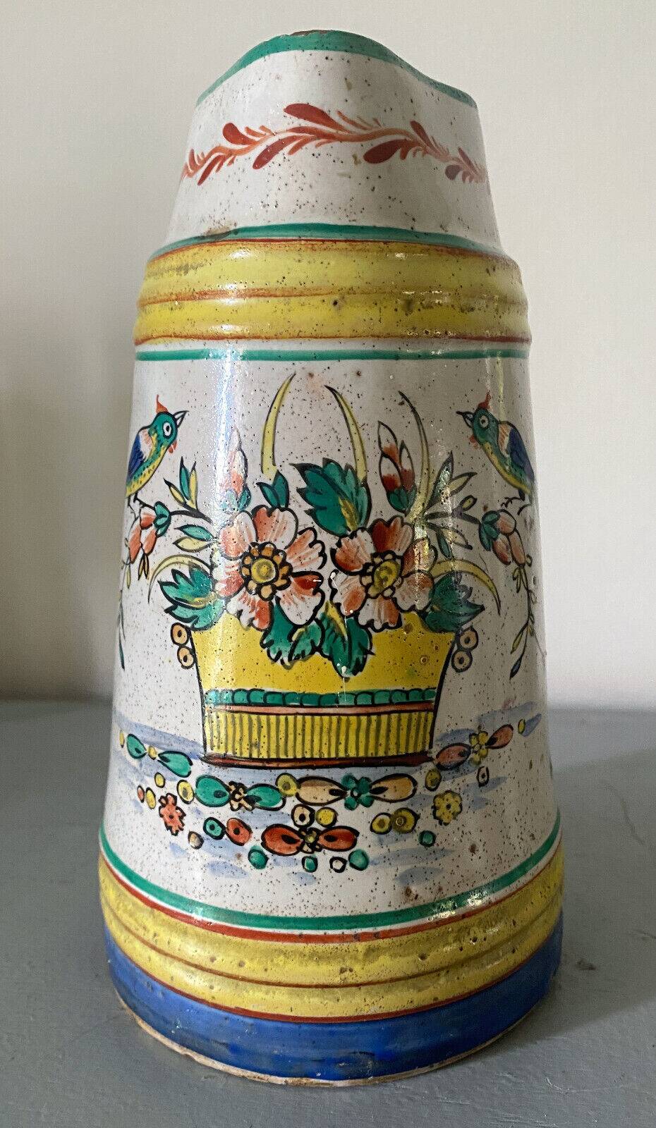 Old ceramic pitcher (18th century?) decorated with polychrome exotic birds