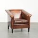 Sleek sheepskin Art Deco design armchair with black piping
