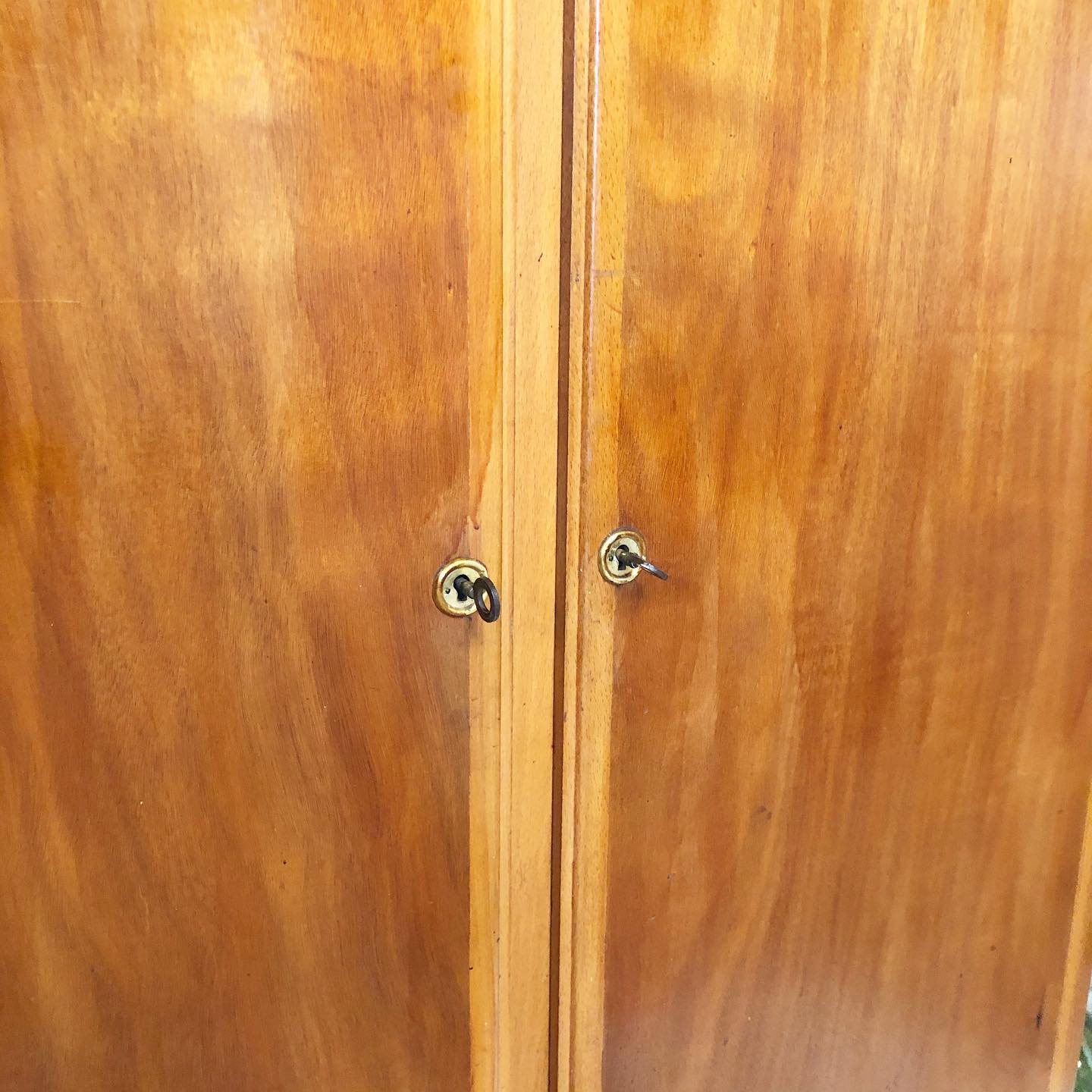 Vintage wooden cabinet with compass feet