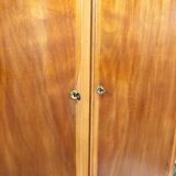 Vintage wooden cabinet with compass feet