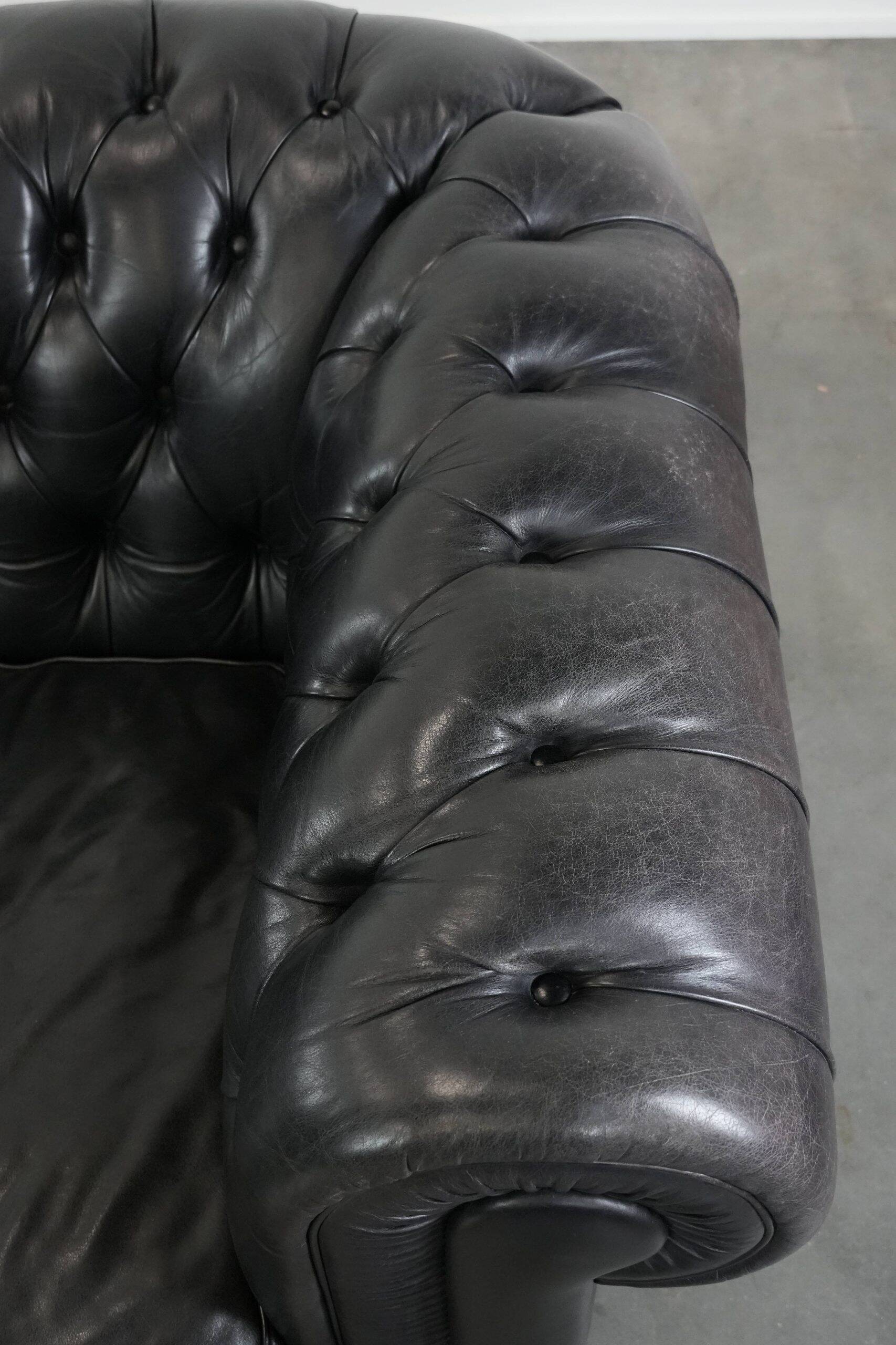 Black chesterfield 3-seater sofa made of cowhide leather in English style