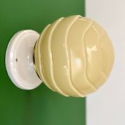 Vintage Art Deco globe wall light in pale yellow opaline.