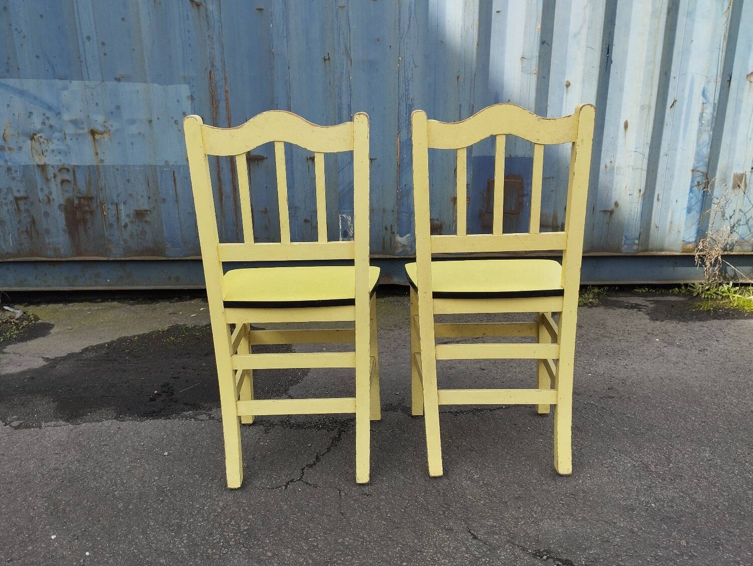 Pair of wooden and yellow formica chairs