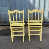 Pair of wooden and yellow formica chairs