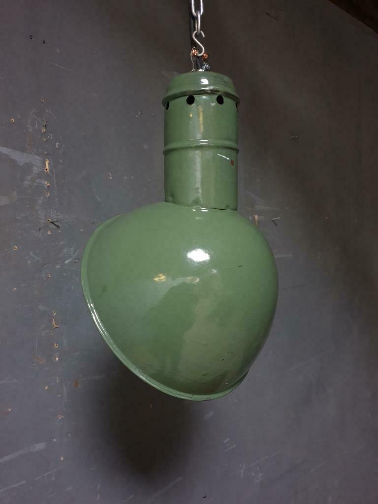 Old industrial enamel lamp in green