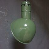 Old industrial enamel lamp in green