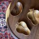 Trio of exotic wooden cups in the shape of beans and vintage clovers