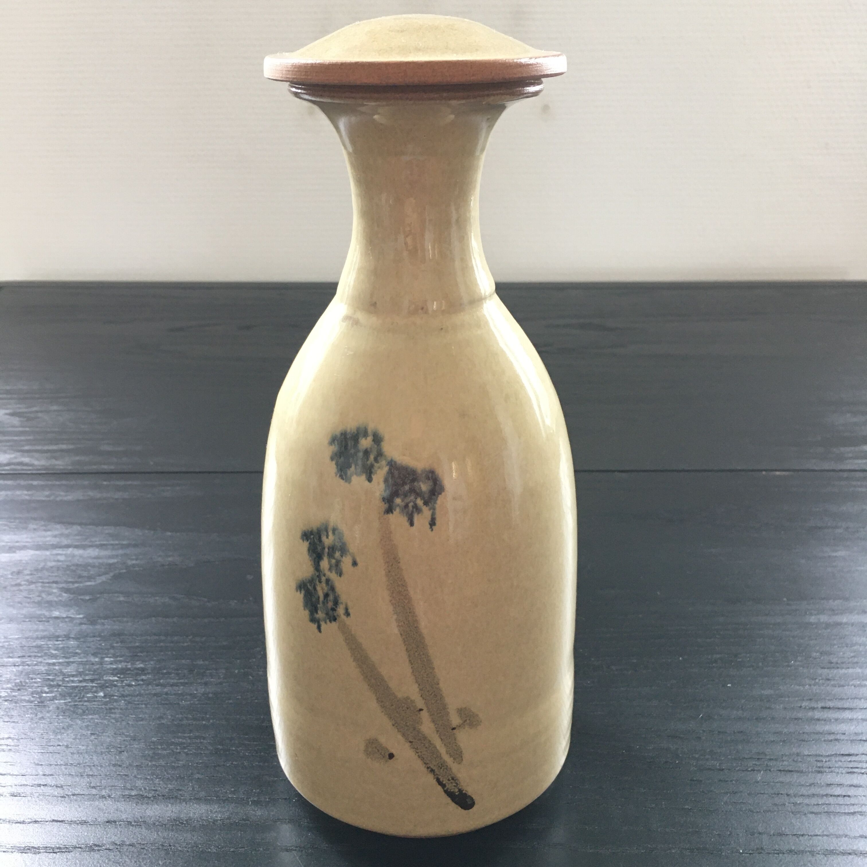 Stoneware carafe with floral decoration