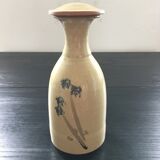 Stoneware carafe with floral decoration