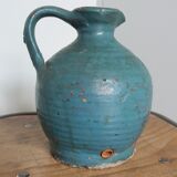 Sandstone pitcher painted in turquoise, very old pottery