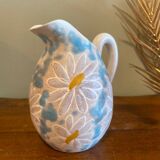 pitcher of daisies