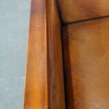 Sheep leather and wood armchair with an Art Deco design