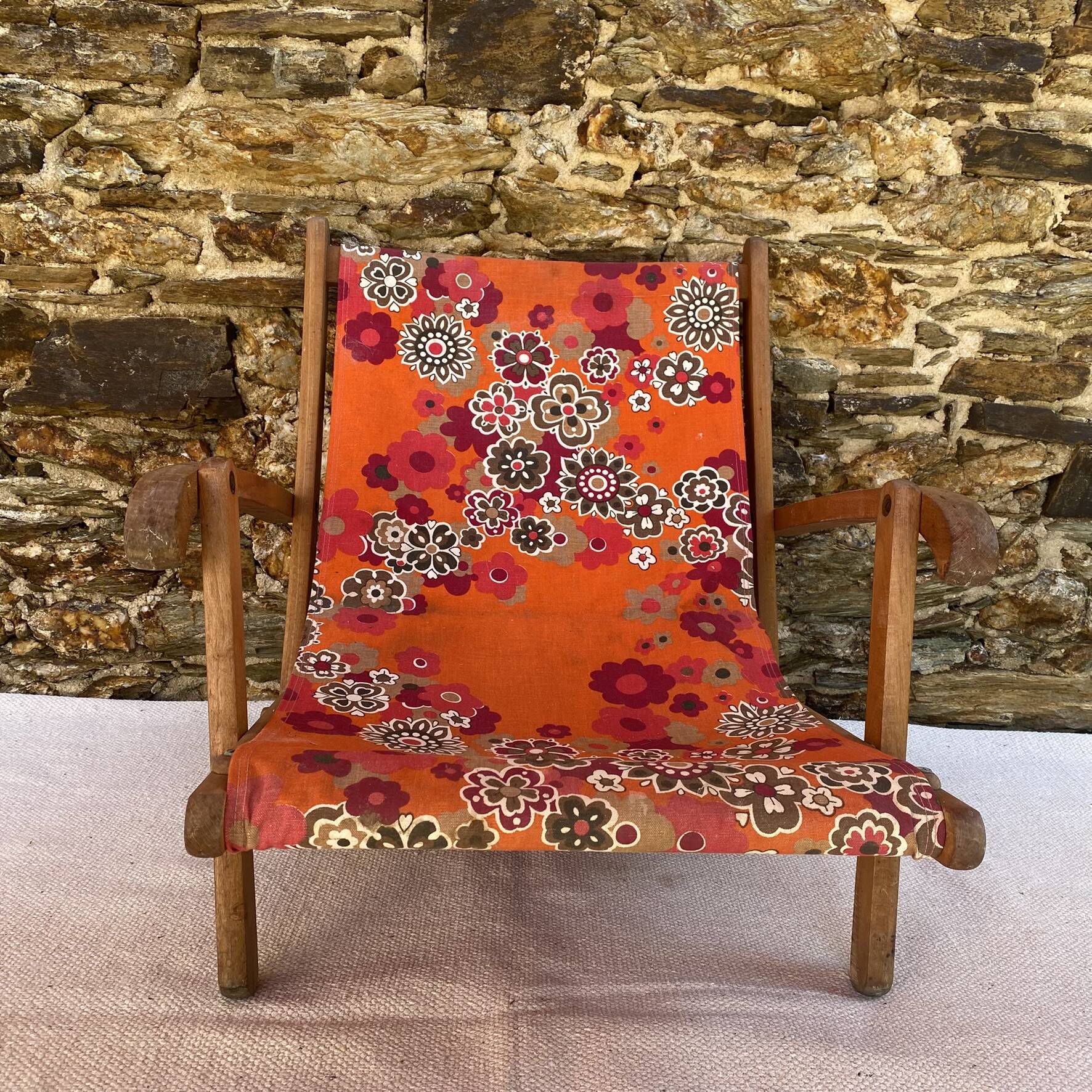 Vintage beach or garden chair made of wood and floral fabric, 1970s.