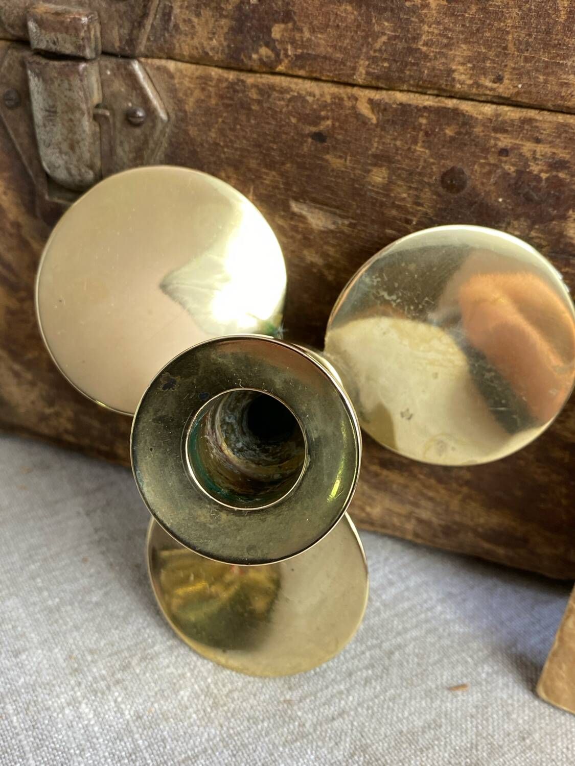 Pair of vintage brass propeller-shaped candlesticks