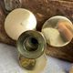 Pair of vintage brass propeller-shaped candlesticks