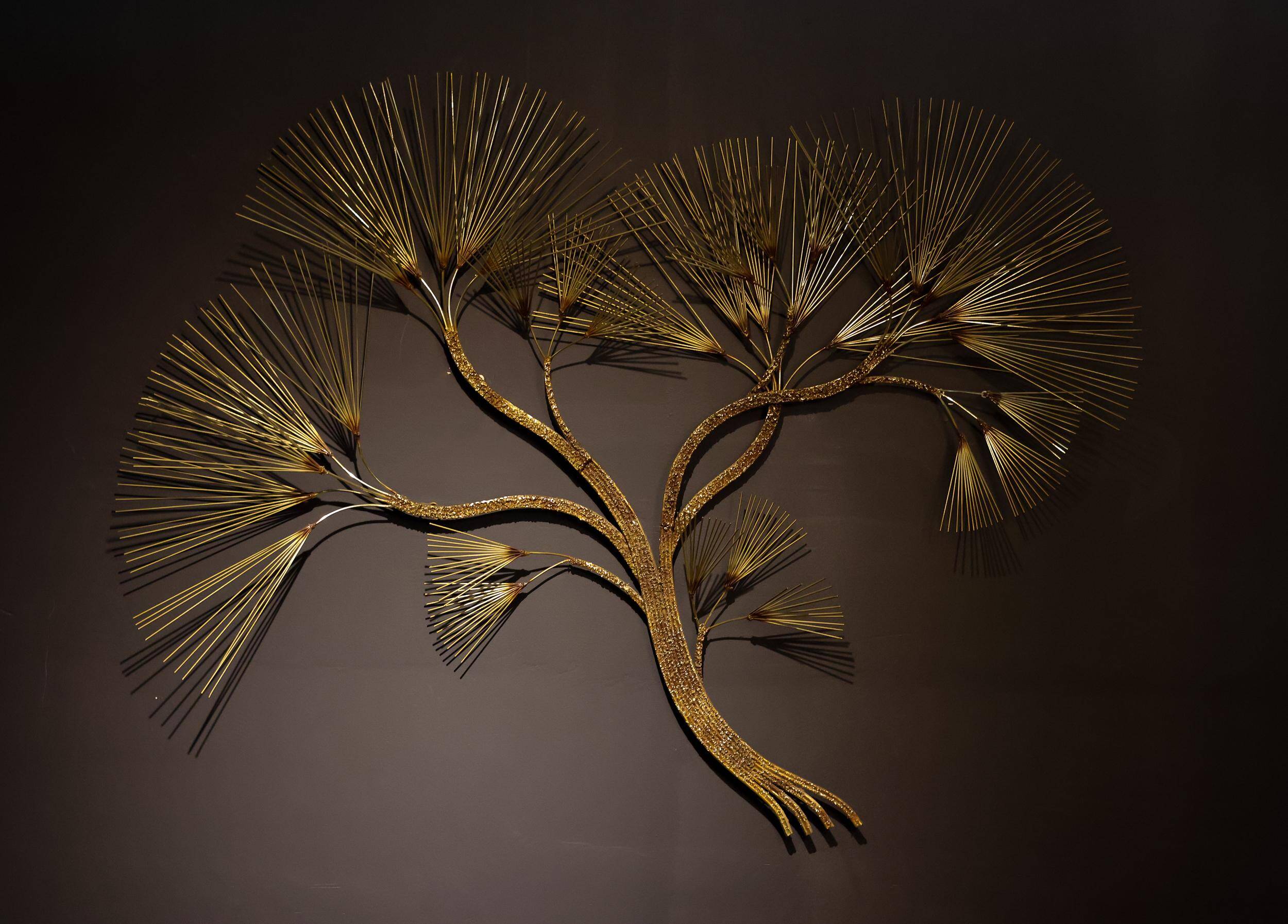 Large wall sculpture in the shape of a tree needle in brass by Curtis Jeré, mid-century modern.