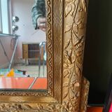 Golden trumeau mirror for fireplace, late 19th century, with sculpted pediment.